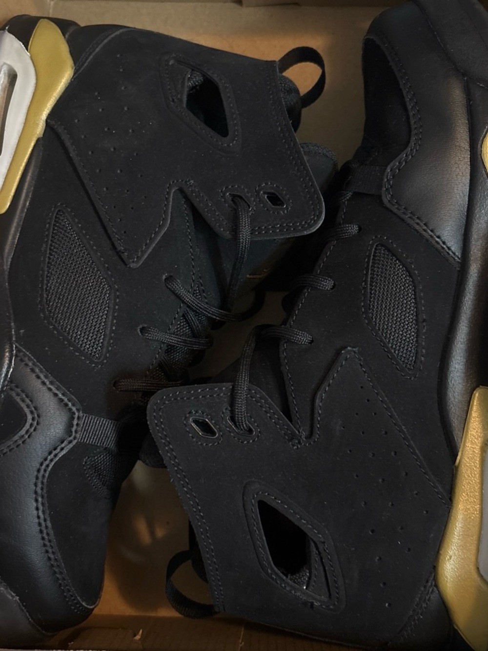 Nike Kids Black Sneakers with Gold Accents